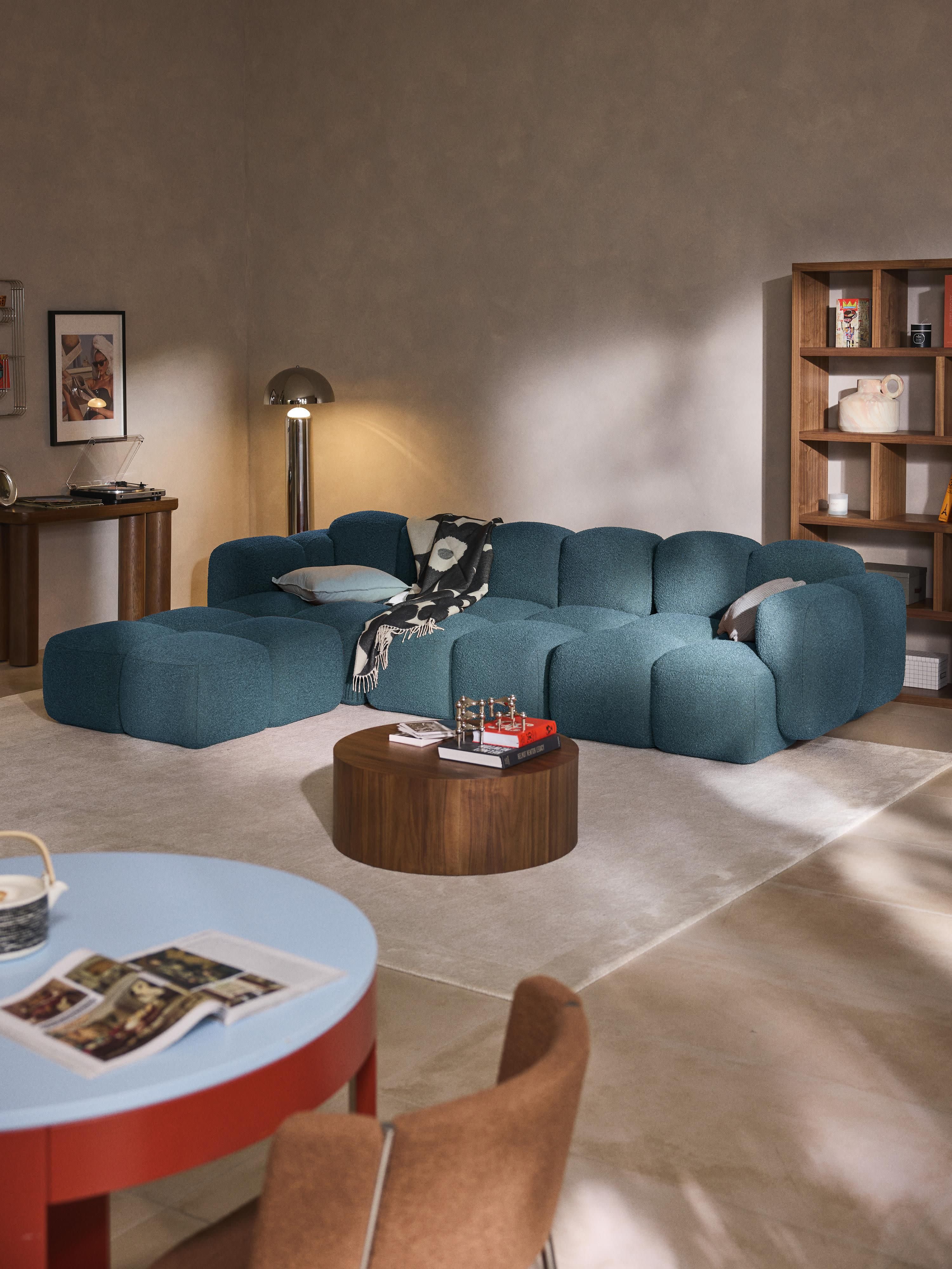 Modulaire bank Tayla (4-zits) van bouclé met poef (links/rechts)
