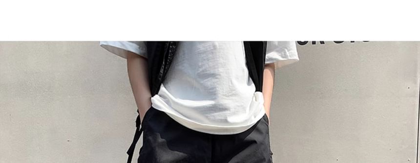 Bjorn - V-hals vest met knoopjes en effen patroon