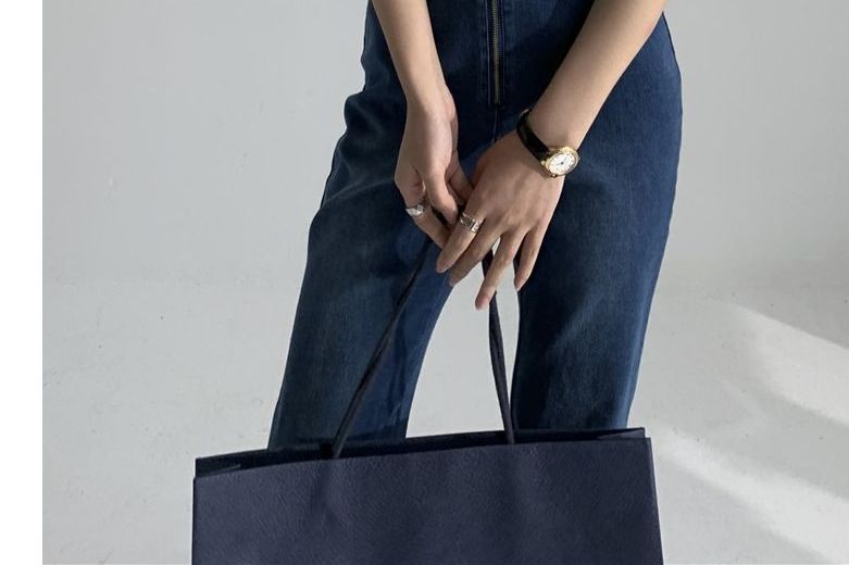 SisLinda - Mouwloze halternek bootcut denim jumpsuit