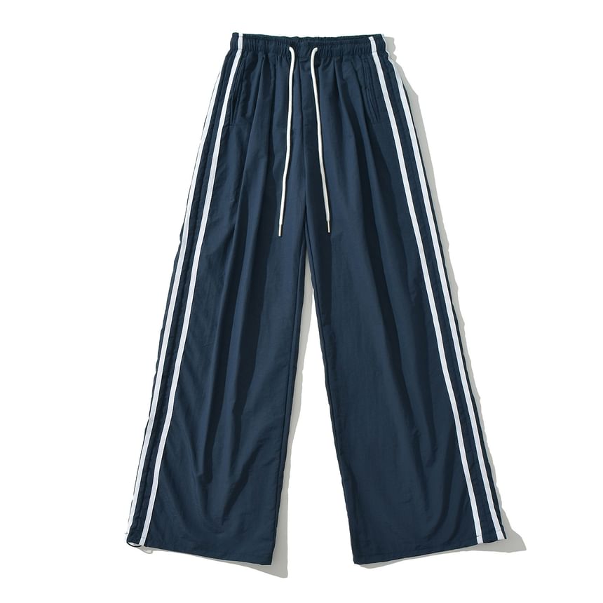 Asiris - Gestreepte, losvallende joggingbroek met hoge taille en wijde pijpen