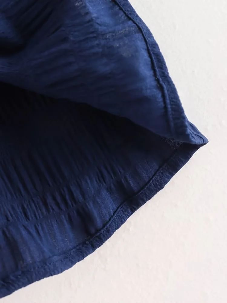 Omelia - Mouwloze blouse met strik / Hoge taille en wijde pijpen