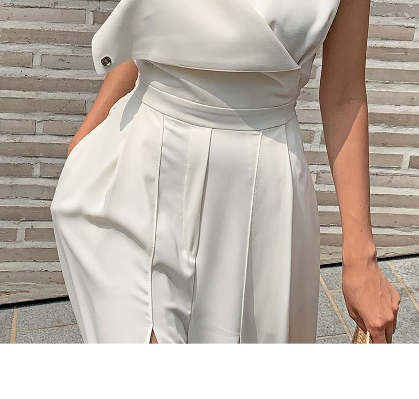 palajana - Mouwloze jumpsuit met split aan de voorkant