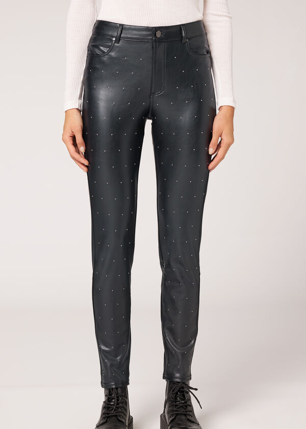 Leggings skinny com efeito térmico e detalhes de tachas por toda a peça.