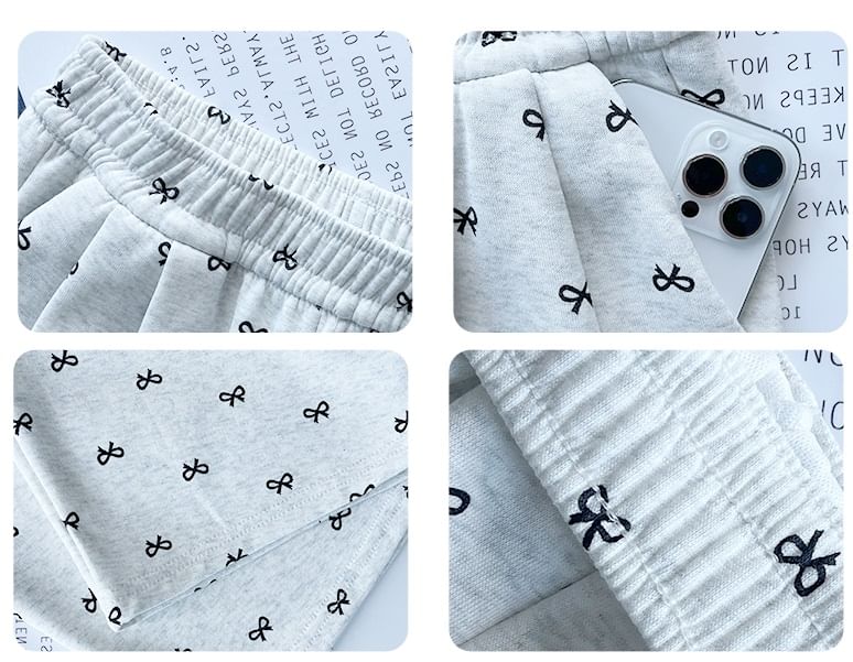 evanesce - Joggingbroek met hoge taille en wijde pijpen en strikprint
