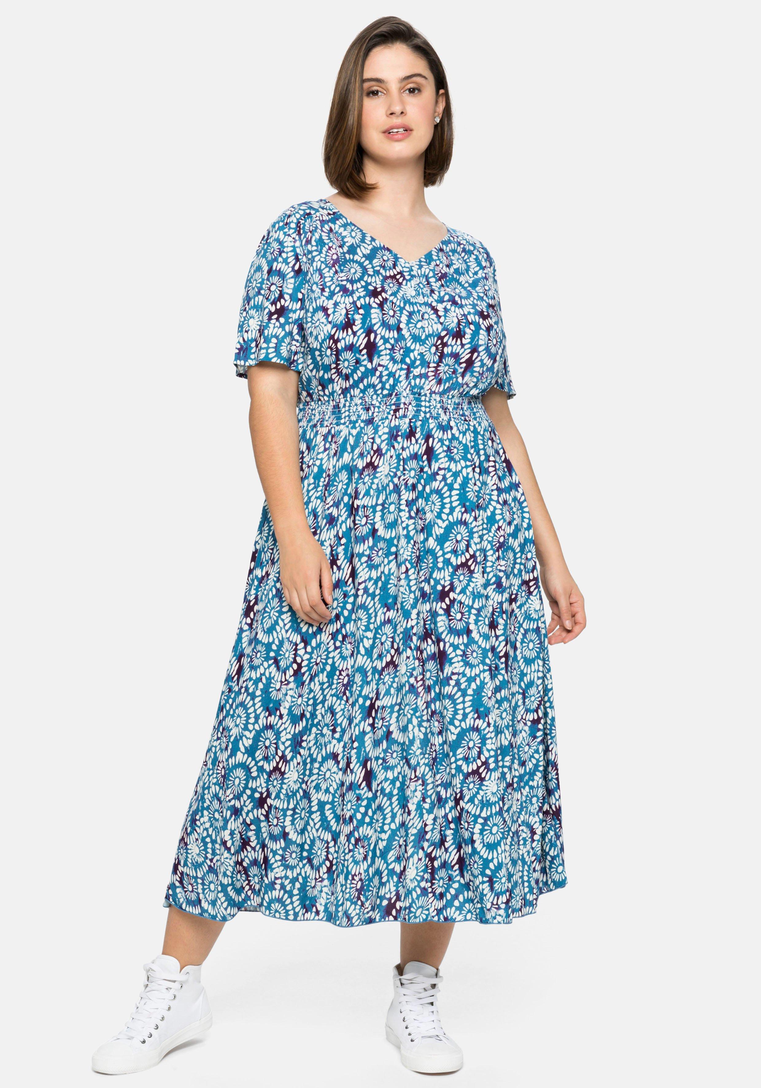 Kleid mit Alloverdruck und Smokbund