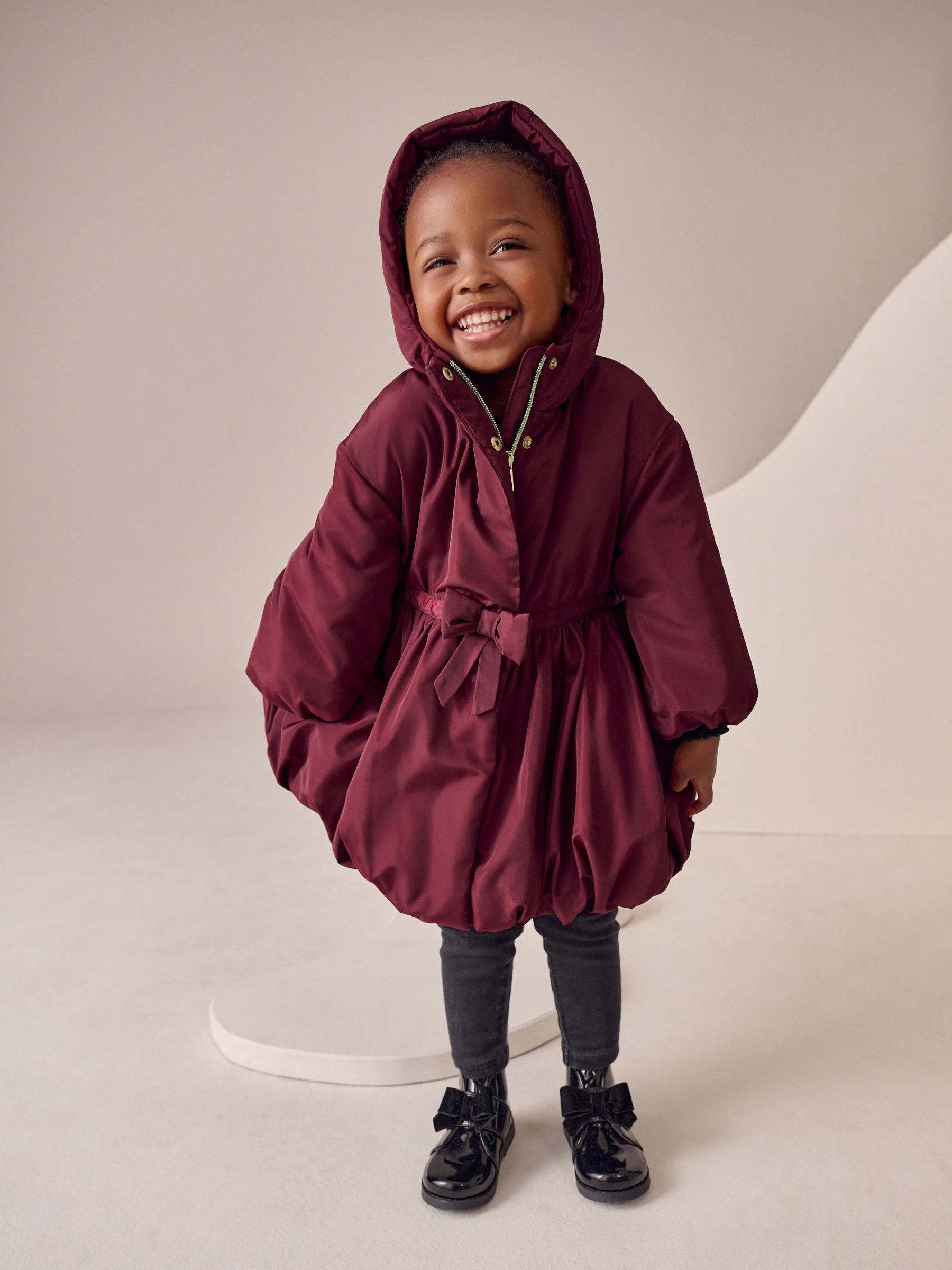 Bordeauxrood - Regenbestendige jas met rok en strikdetail (3mnd -7jr)