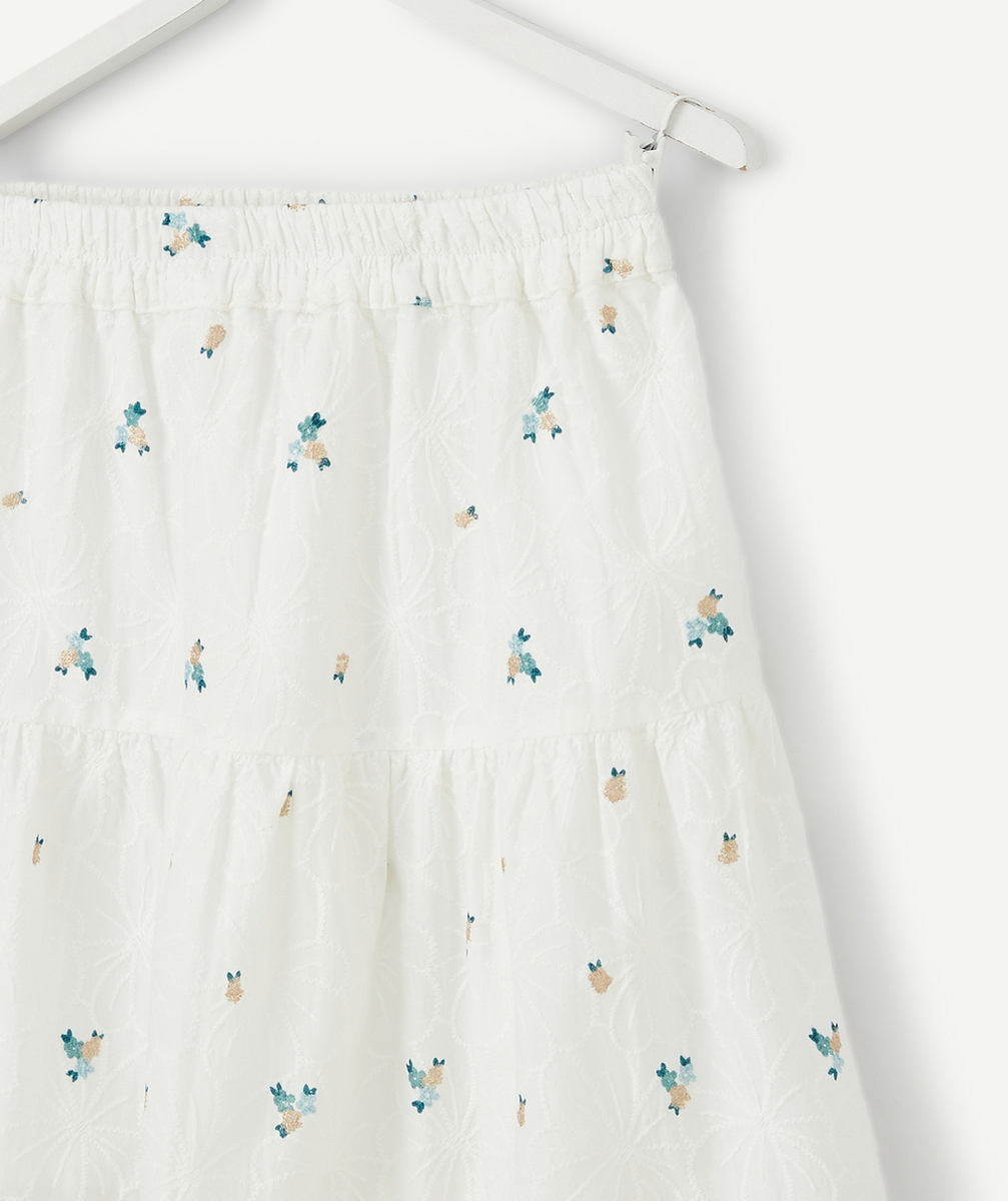 LA JUPE LONGUE BLANCHE EN COTON AVEC FLEURS ET DÉTAILS COULEUR DORÉE