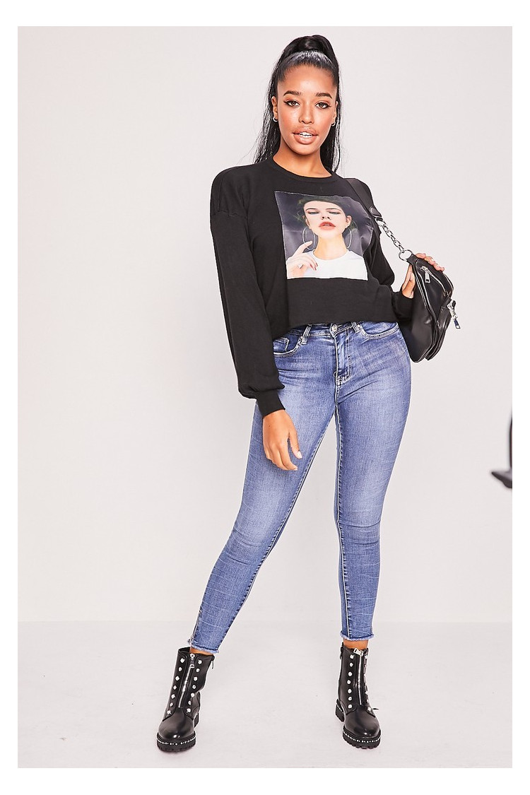Pull noir tête de femme