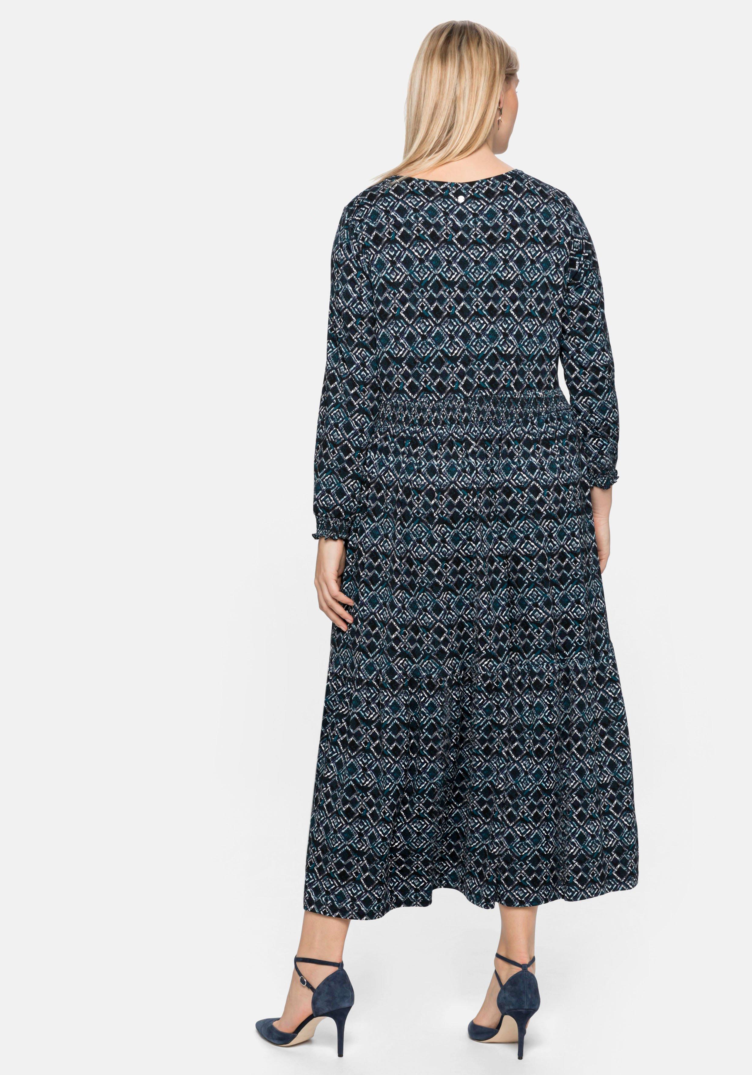 Jerseykleid mit Alloverdruck und Smokdetails