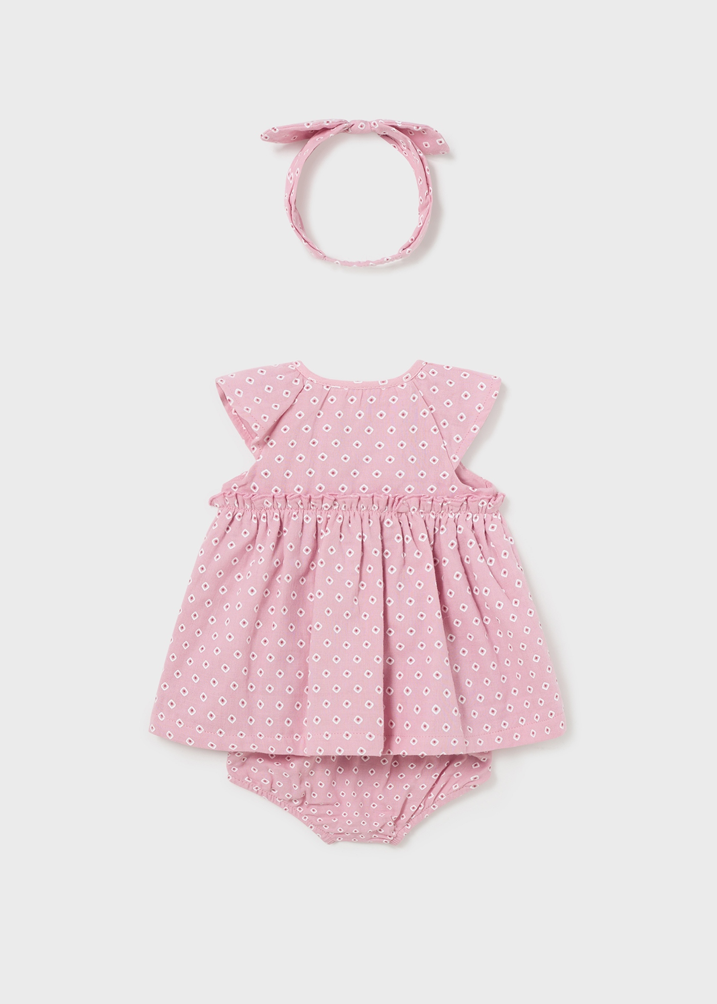Vestido Jade para recém-nascido da Better Cotton com capa de fralda e faixa de cabelo.
