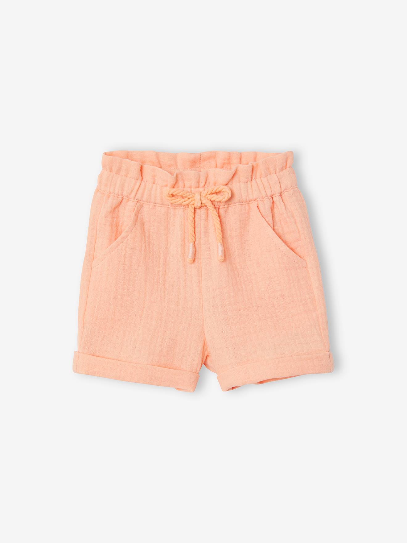 Calções de bebé com cintura elástica em chiffon de algodão liso cor laranja claro.