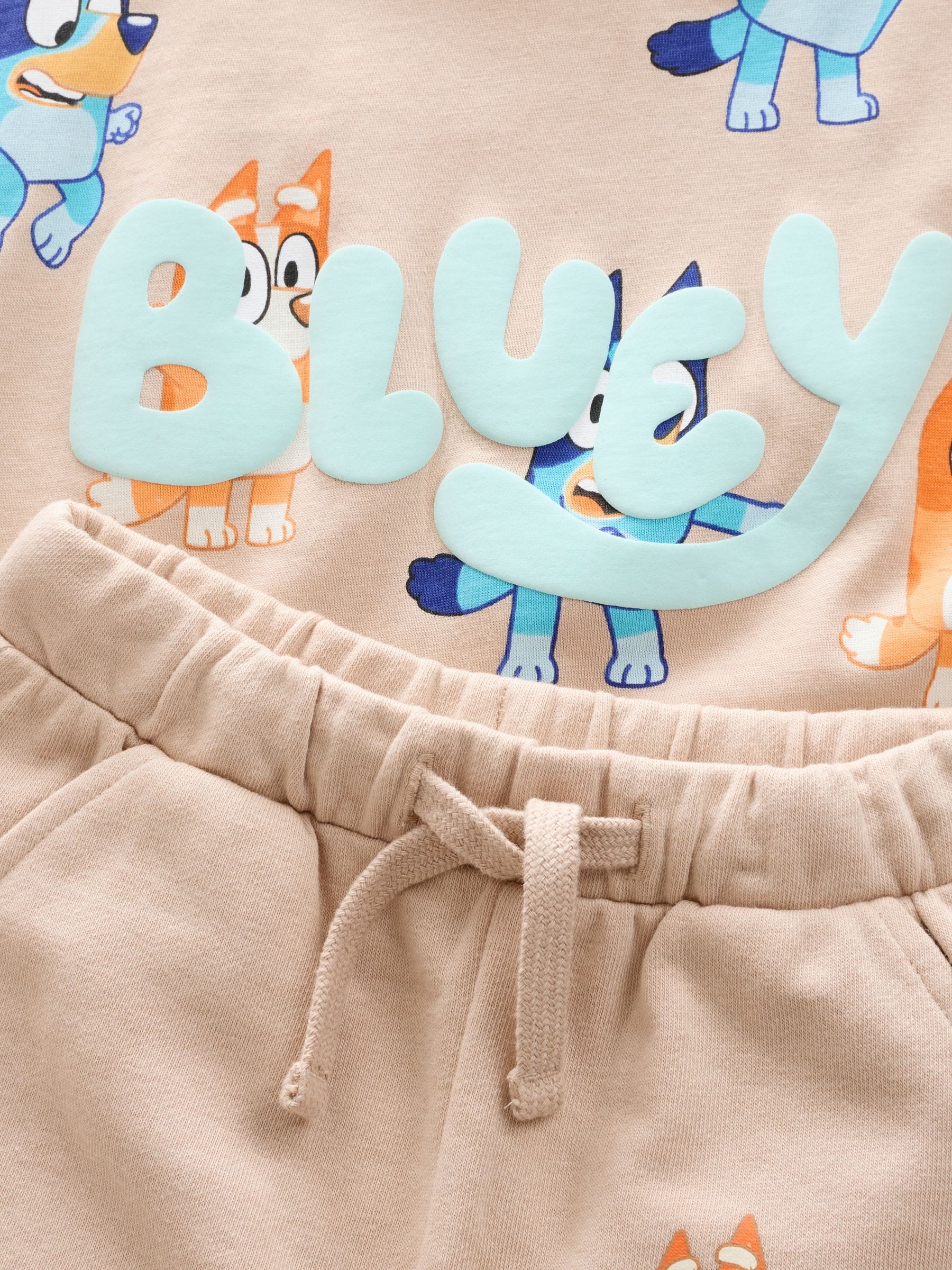 Neutraal - Set van blauw T-shirt met all-overprint en shorts met Bluey (12mnd -8jr)