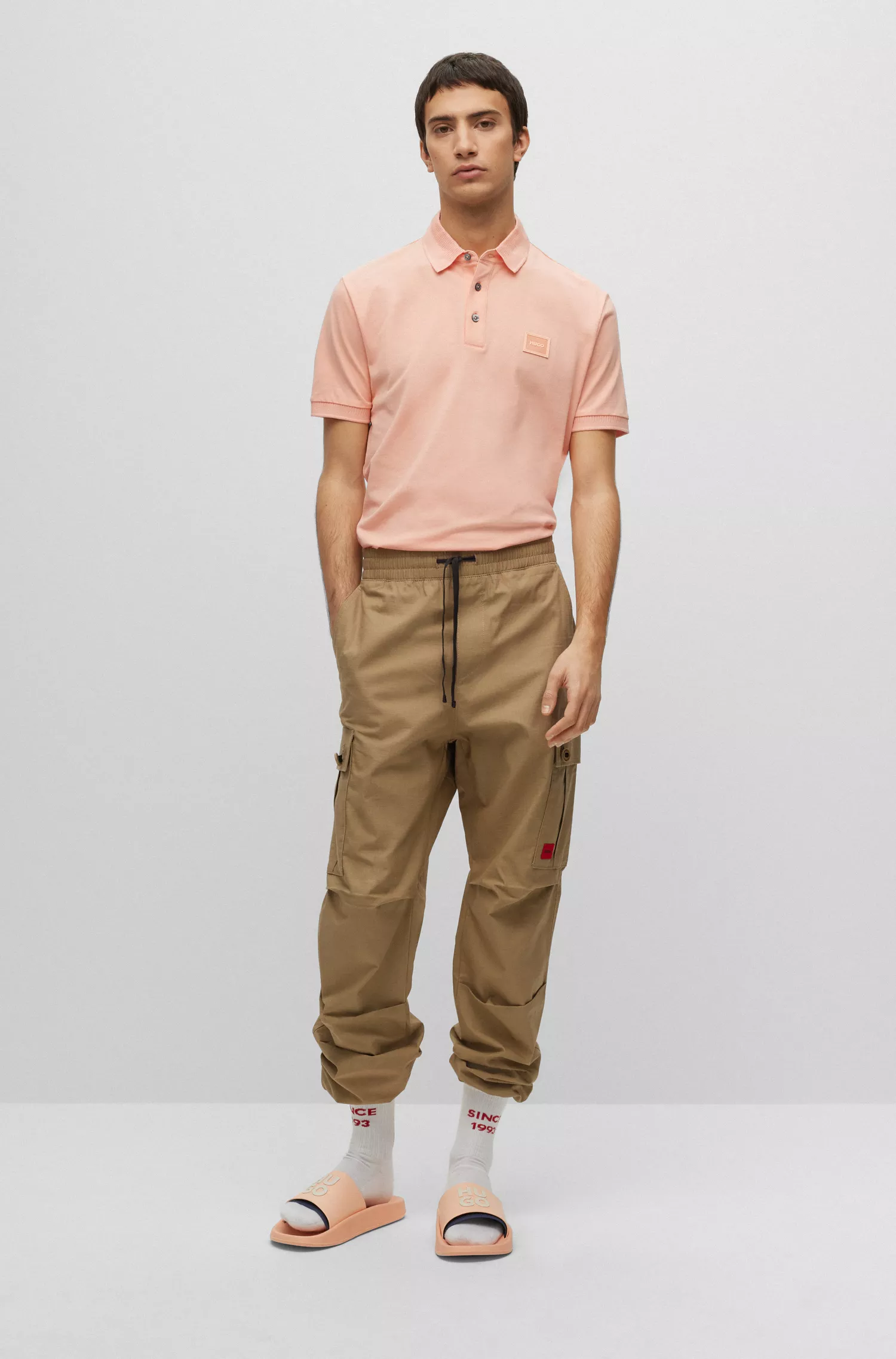 Camisa polo HUGO vermelha em piqué de algodão com corte slim e emblema com o logotipo.