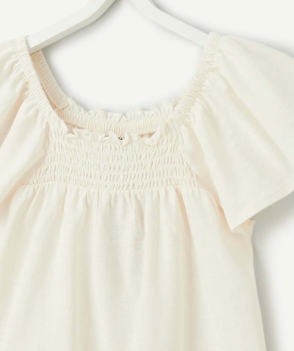 t-shirt fille en coton biologique écru avec col bardot et volants