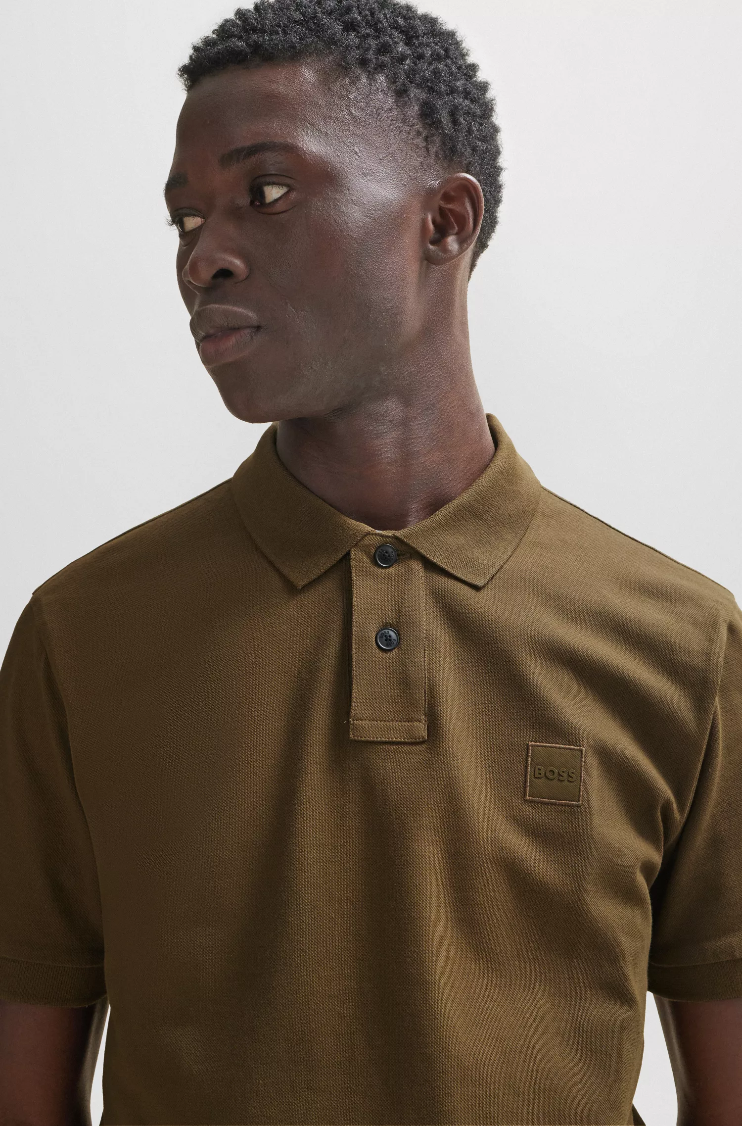Camisa polo BOSS laranja, de algodão stretch, corte slim, com etiqueta de logotipo.
