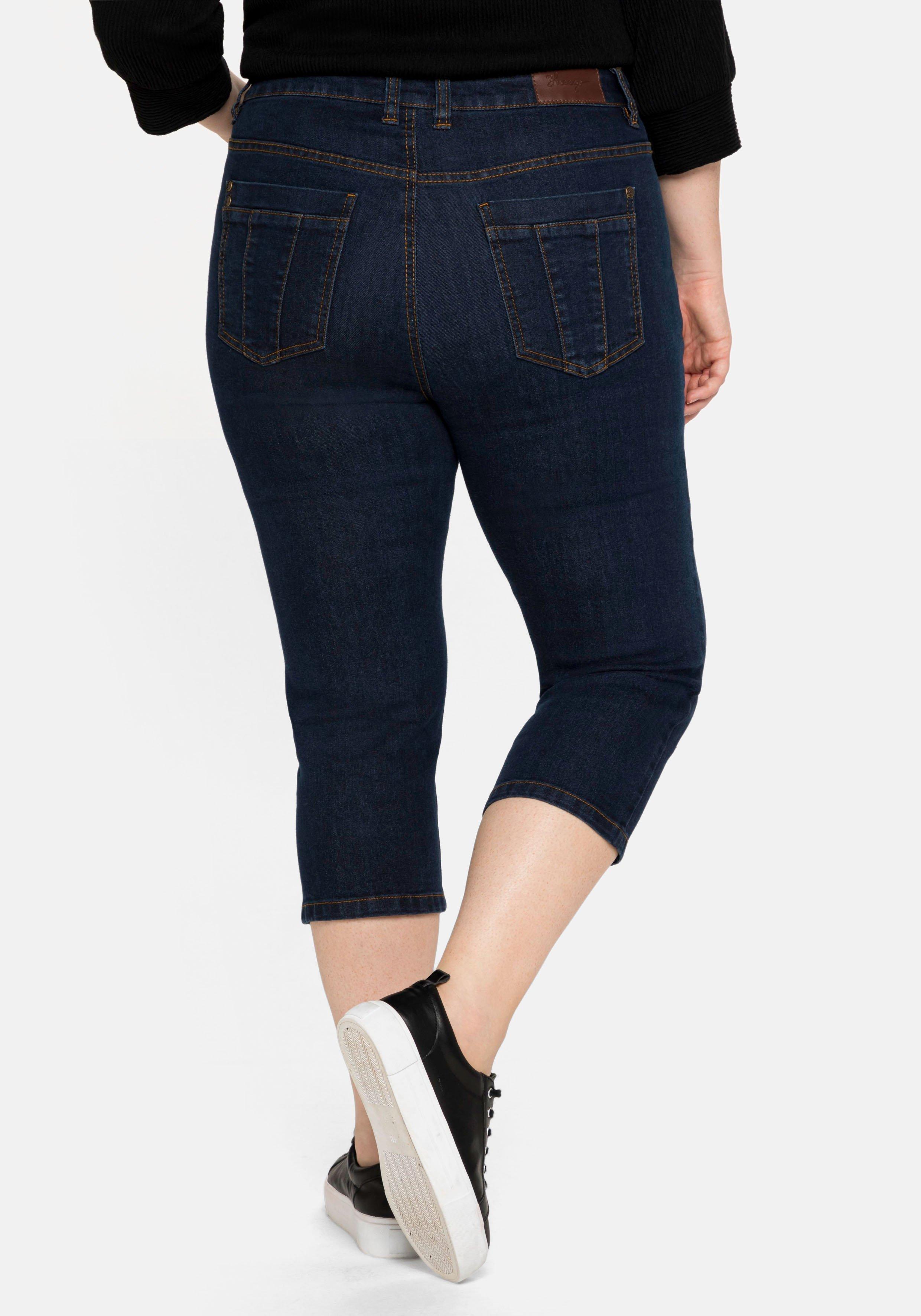 Caprijeans mit Catfaces und Kontrastnähten