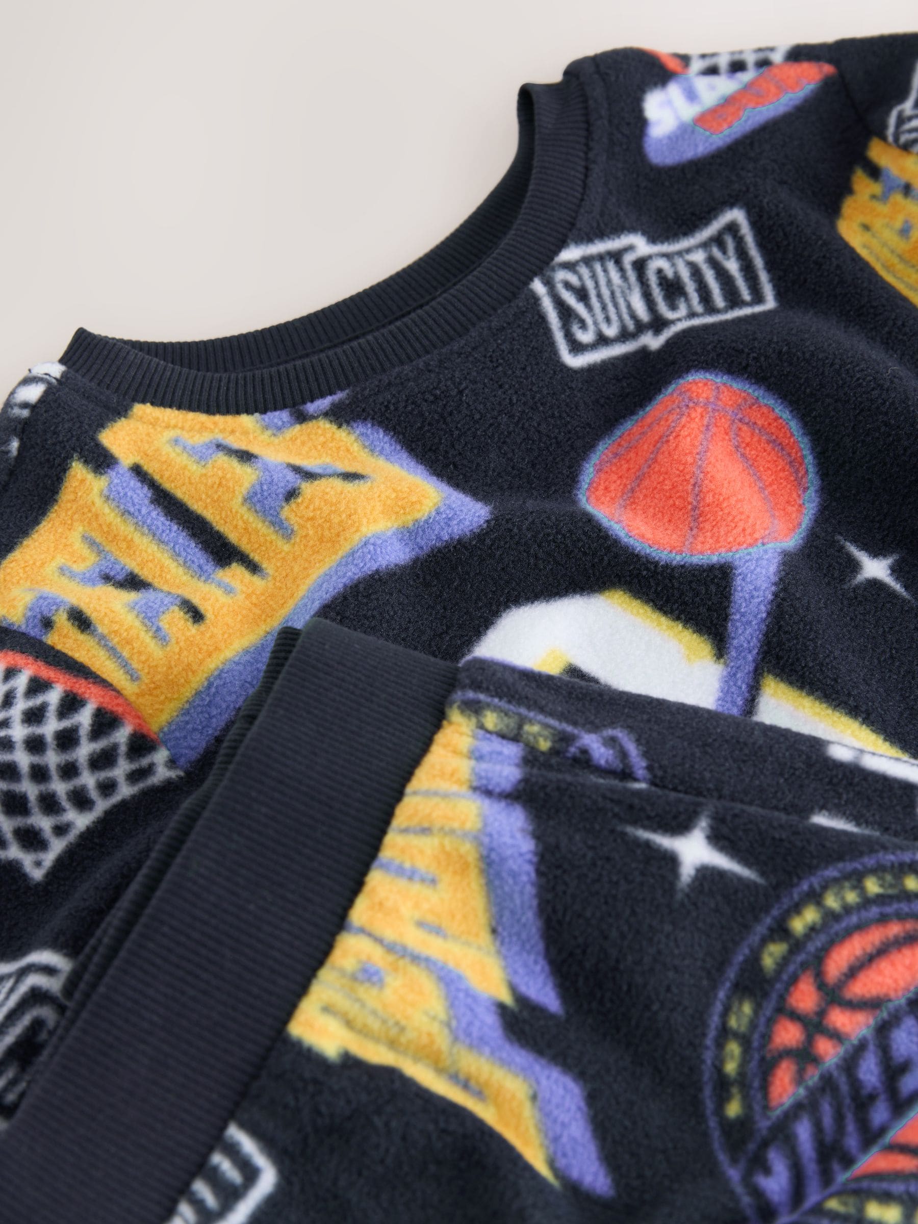 Multi-basketbal - Enkele behaaglijke fleece pyjama (3 - 16 jr)
