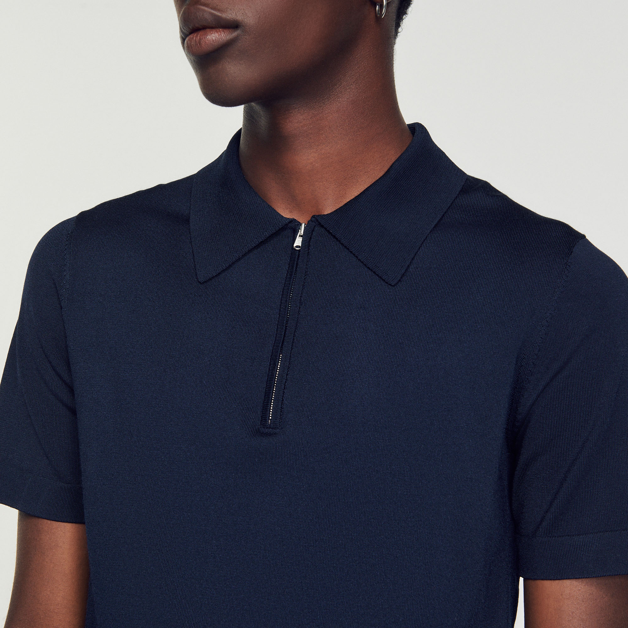 Polo en maille á col zippe