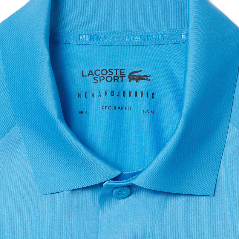 Polo tennis Lacoste Djokovic US Open bleu
