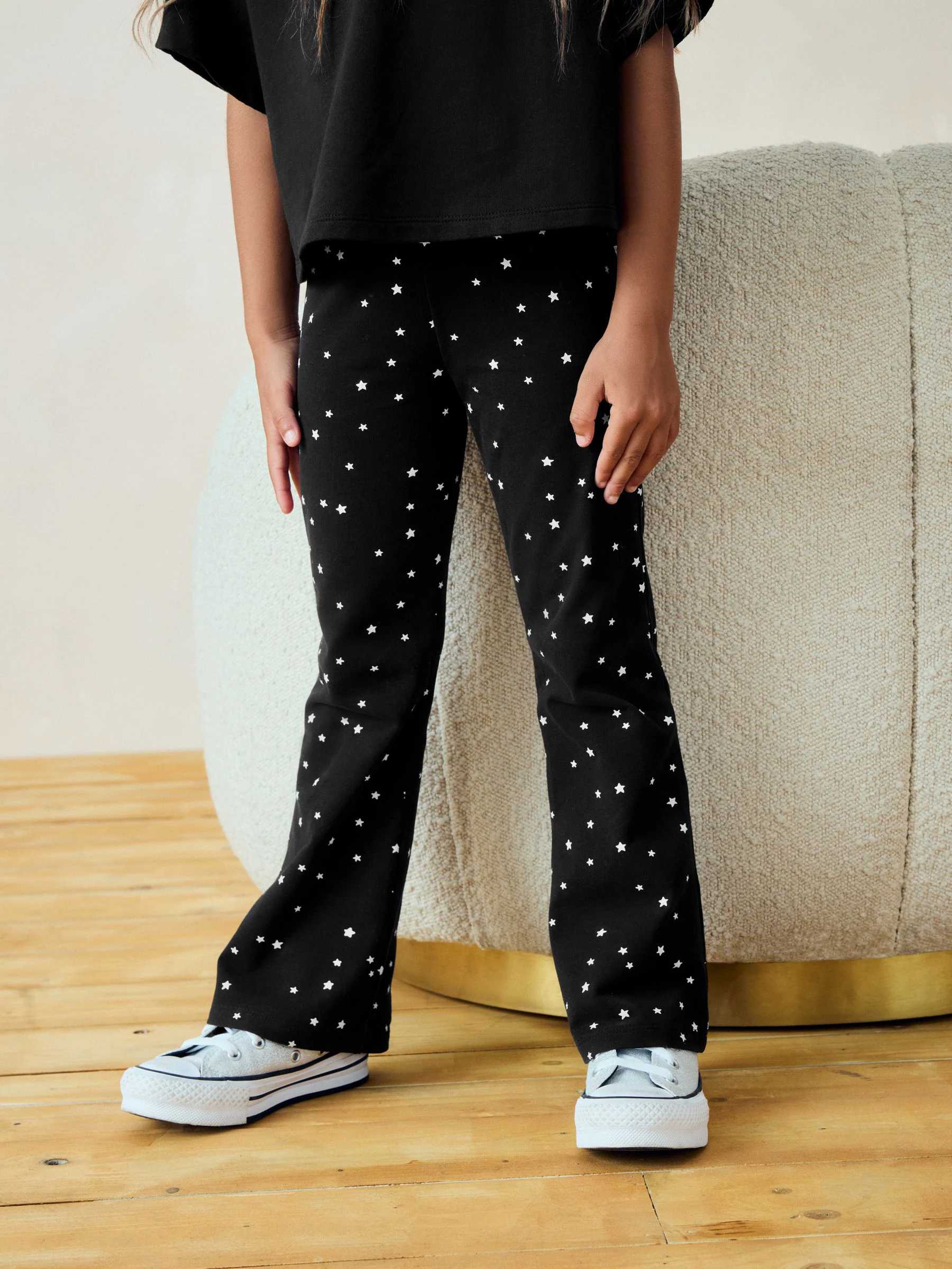 Zwart met sterrenprint - Uitlopende legging (3-16jr)