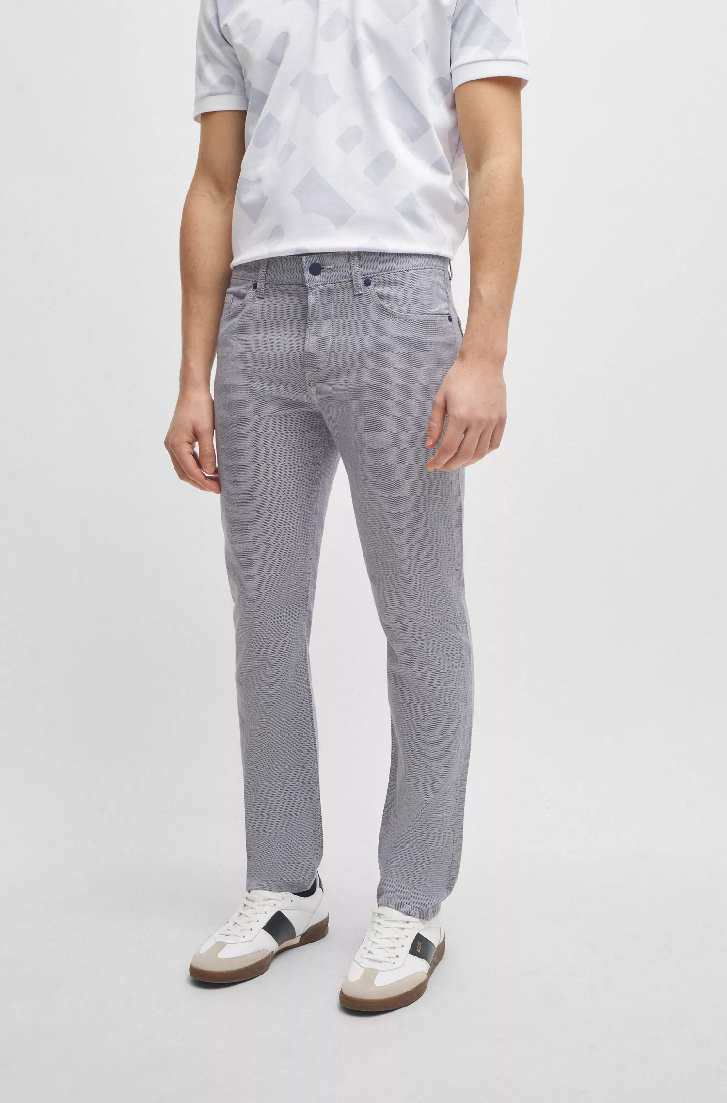 Calça jeans BOSS preta, corte slim, em denim stretch bicolor.