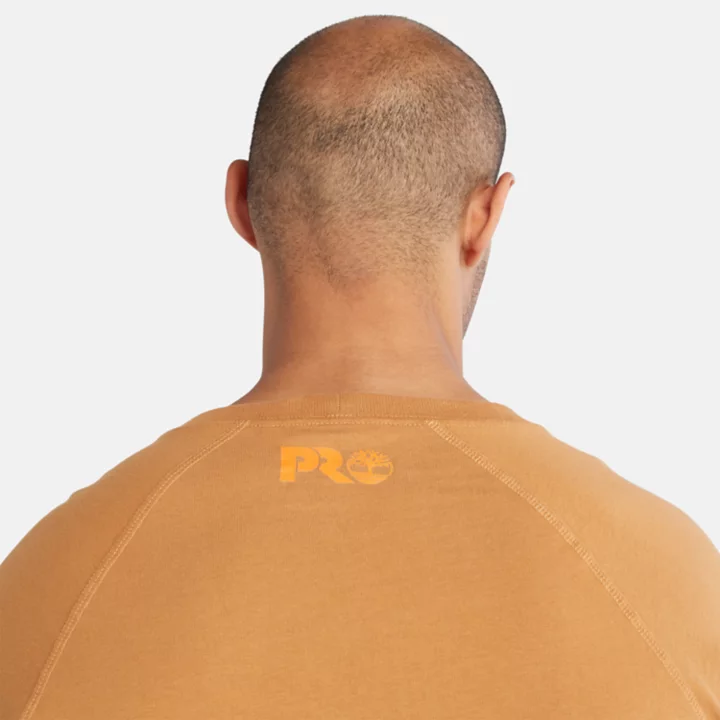 Camiseta Timberland PRO Core de manga comprida para homem, na cor laranja.