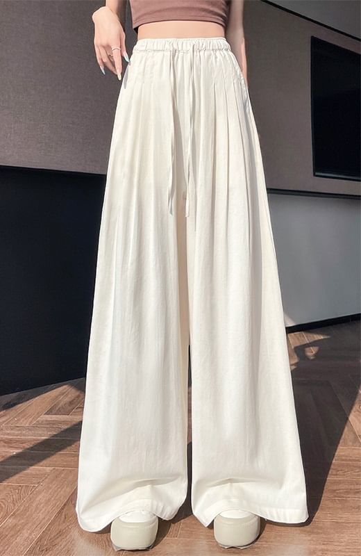 Tel tot 10 - Effen broek met wijde pijpen en trekkoord in de taille (verschillende ontwerpen)