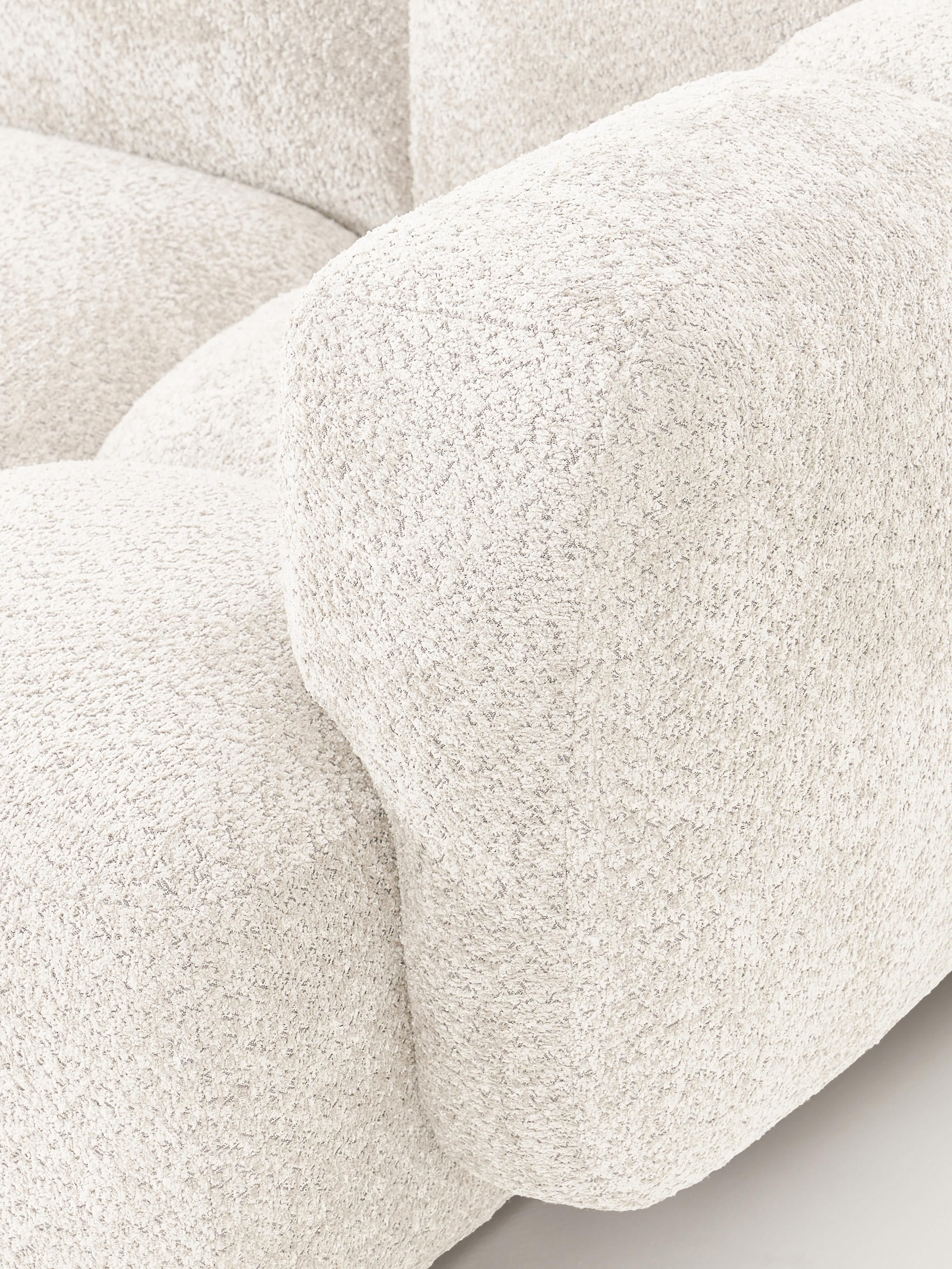 Modulaire bank Tayla (3-zits) van teddy bouclé met poef (links/rechts)