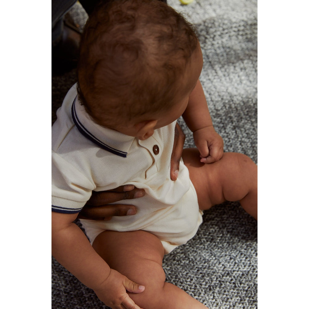 Køb COPENHAGEN COLORS Cream Comb. Pique Polo Romper