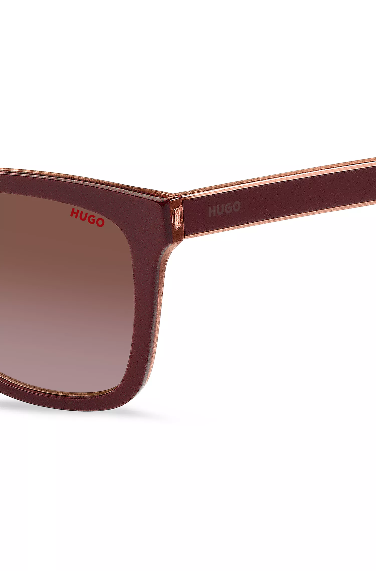 Óculos de sol HUGO em acetato vermelho-bordô com hastes personalizadas.