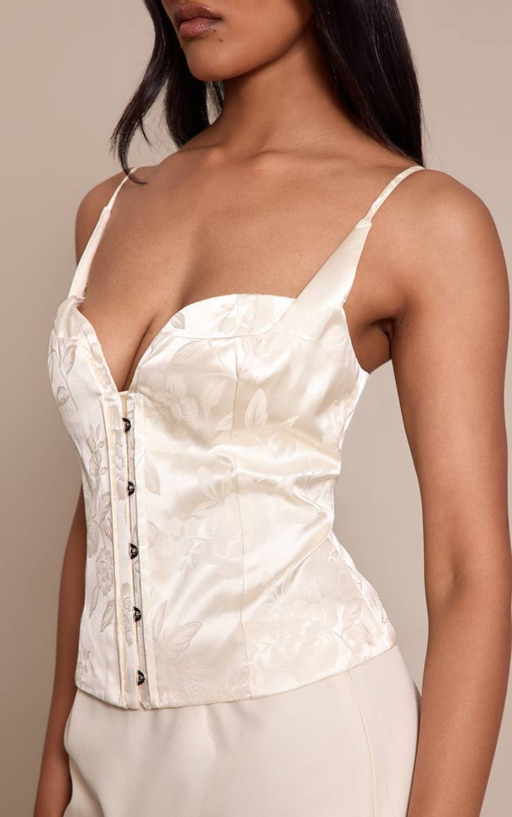 Crème Corset À Agrafes Avec Motif Floral En Relief