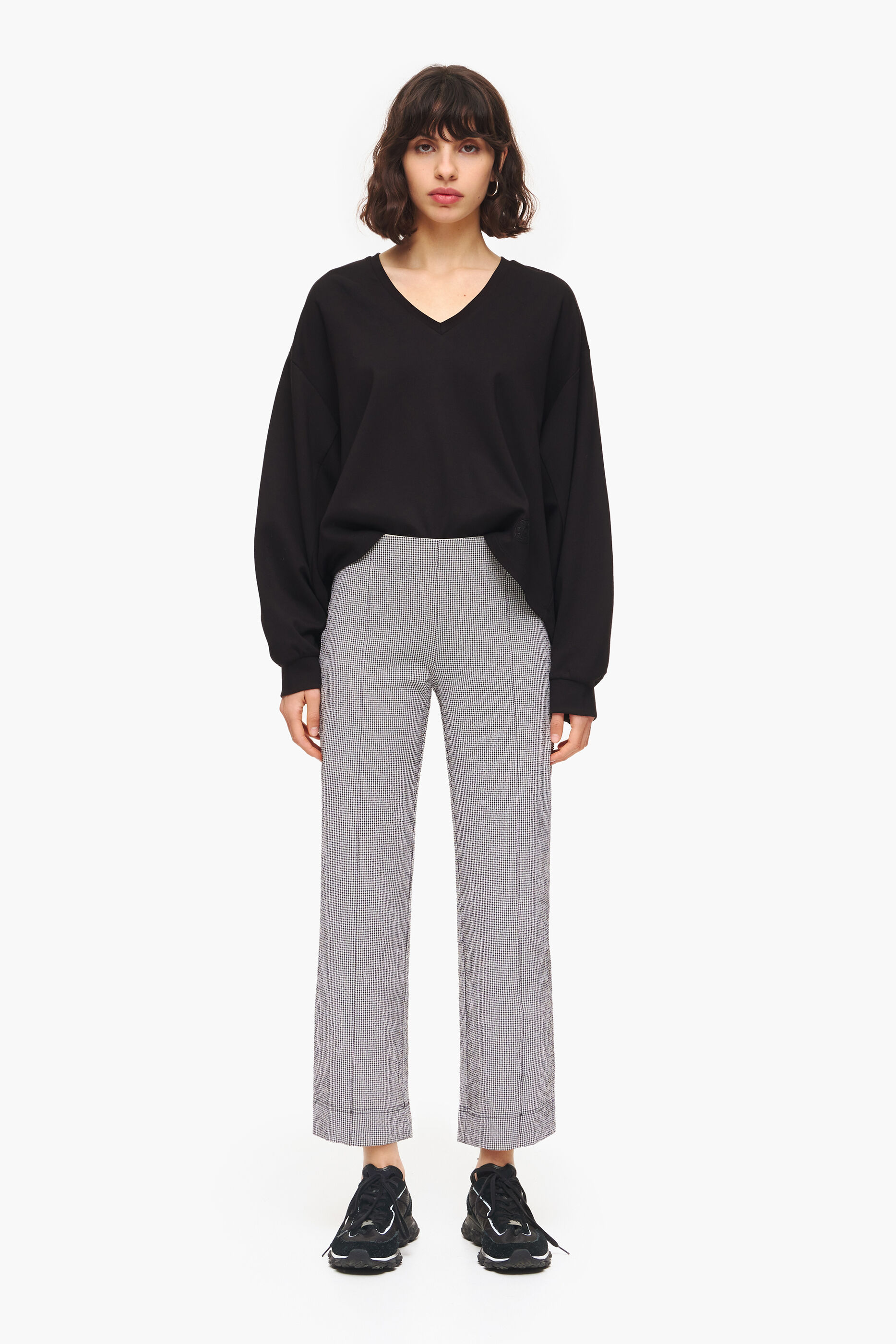 Calça boca de sino xadrez preta