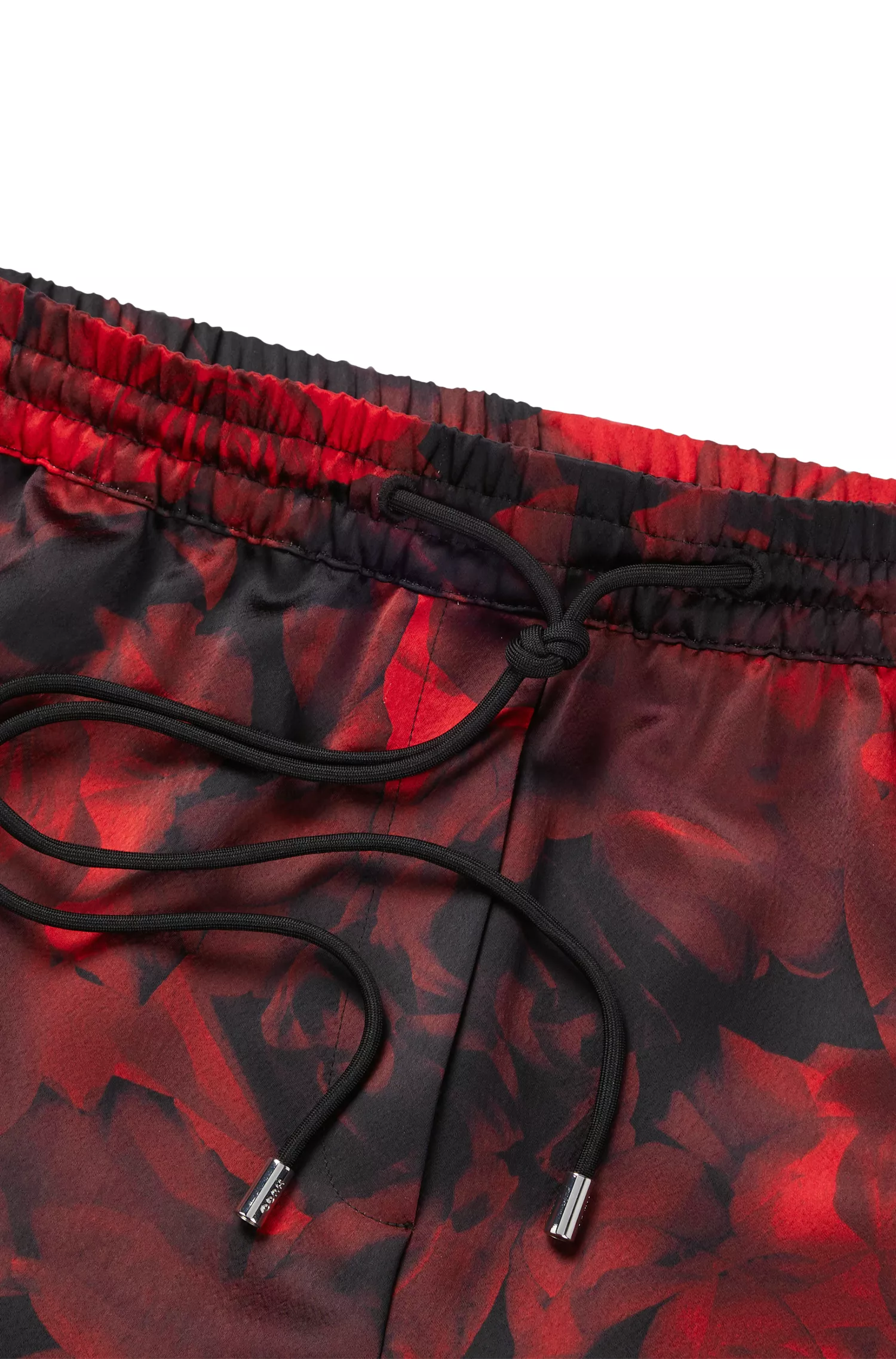 Calça HUGO vermelha de pernas largas e corte relaxado com estampa de rosas.