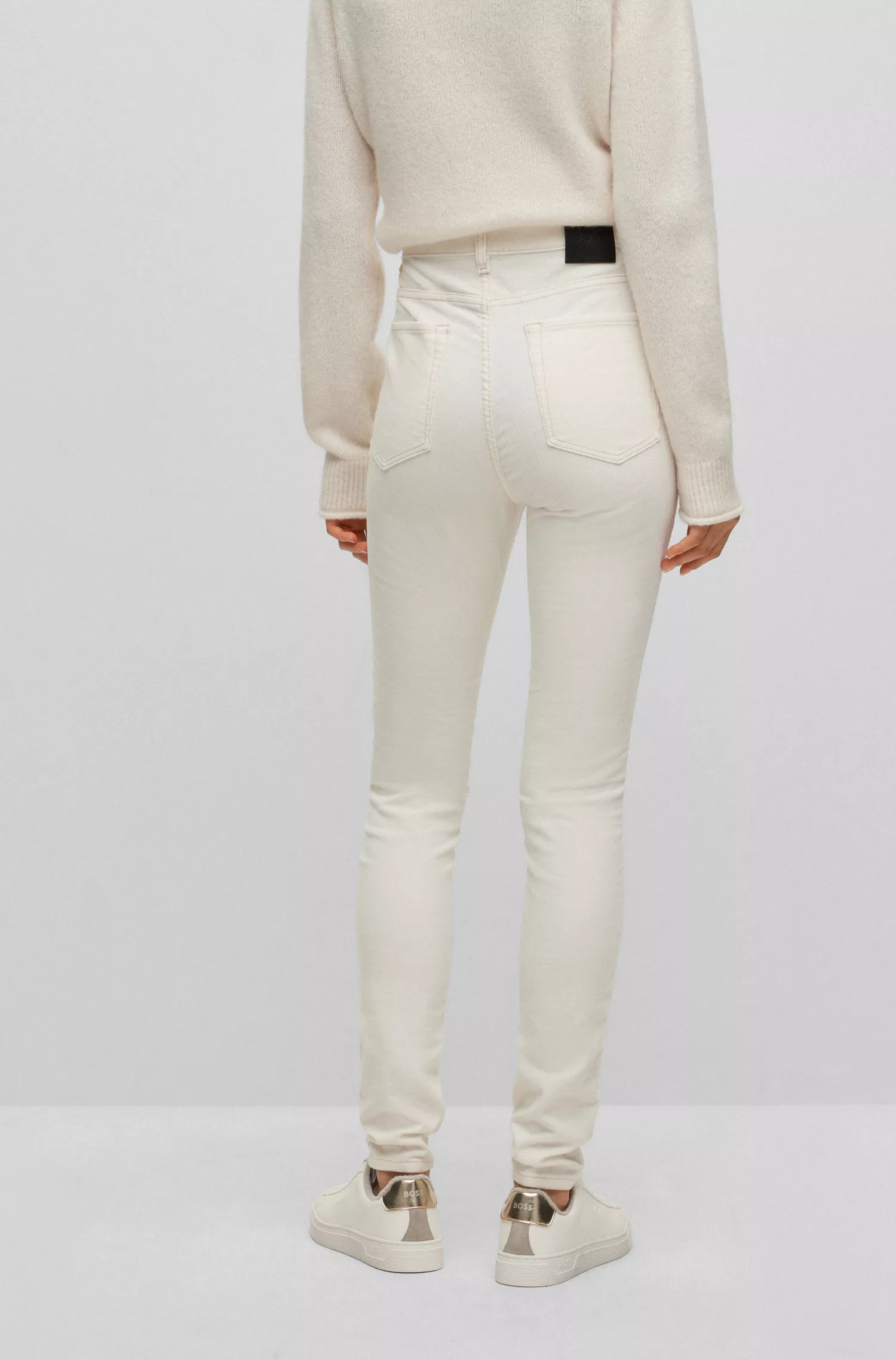 Calça jeans BOSS laranja de cintura alta em veludo cotelê de algodão elástico.