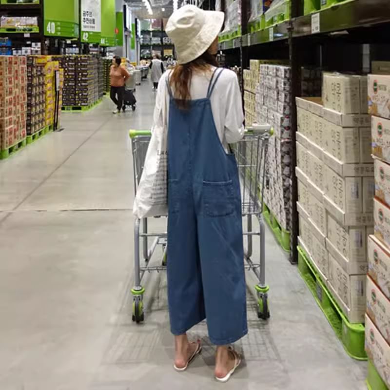 Felixia - Mouwloze denim jumpsuit met wijde pijpen
