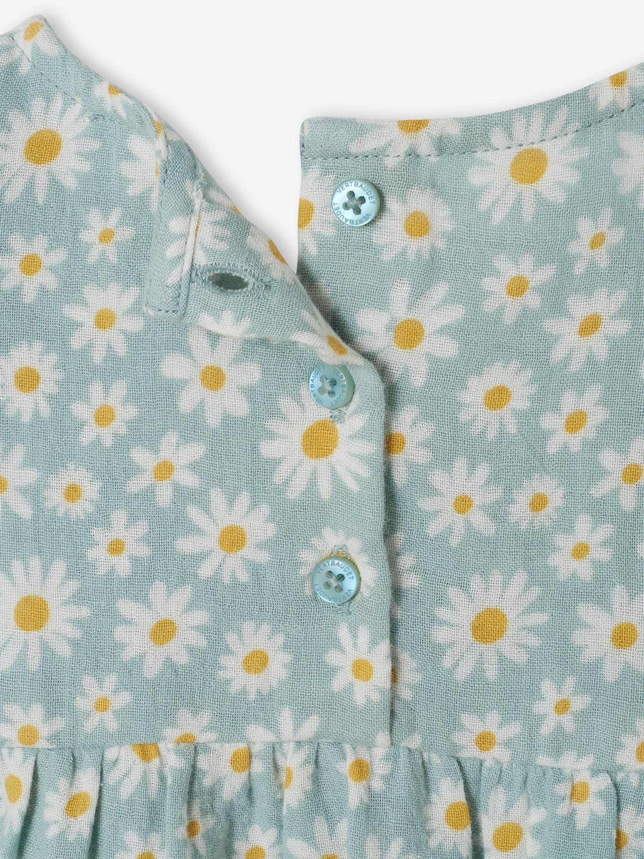 Blusa infantil azul acinzentada com babados.