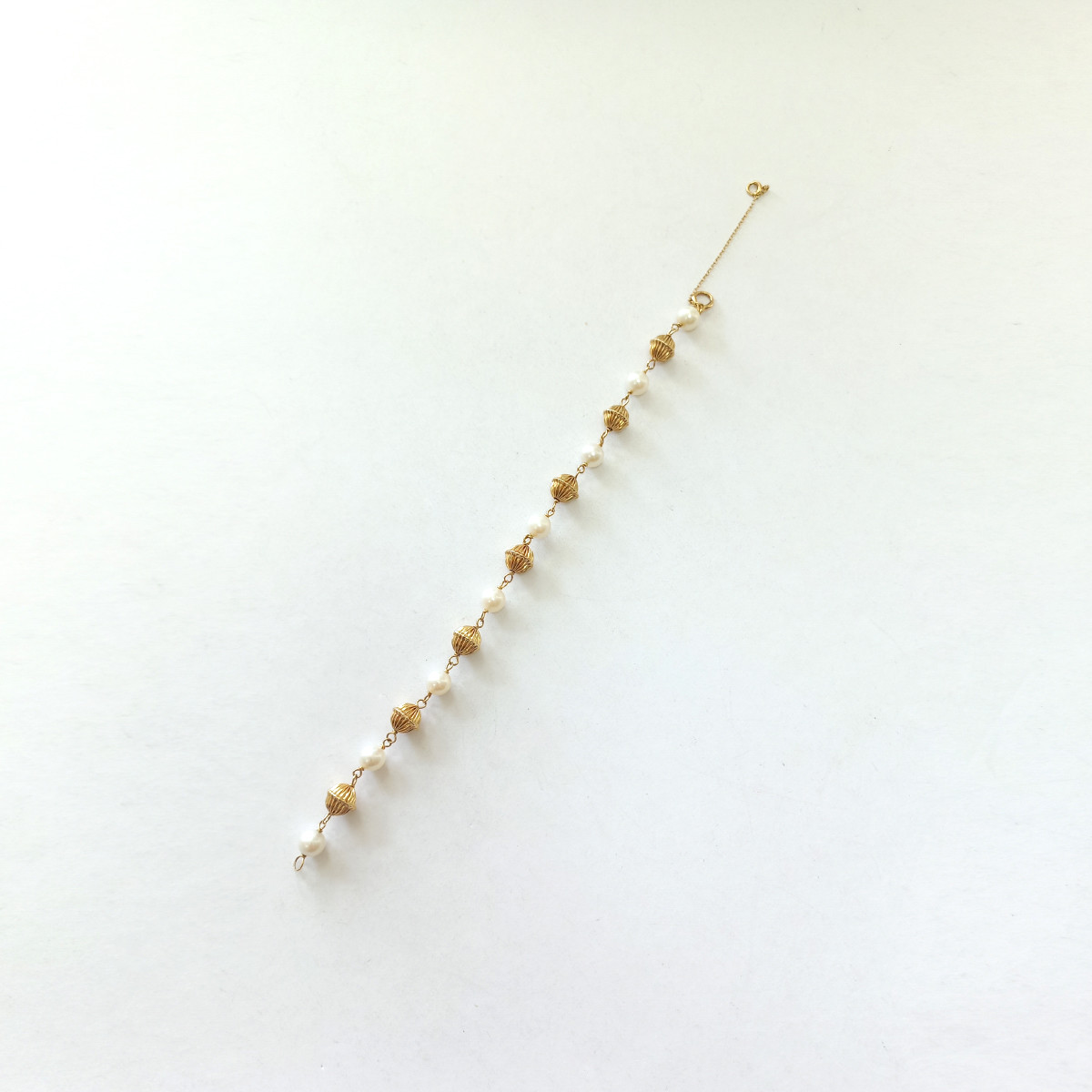 Bracelet d'occasion or 375 jaune perles de culture blanches