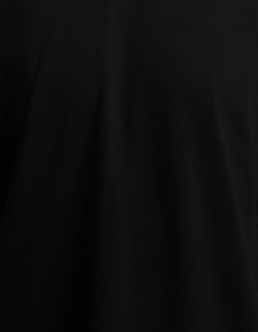 Camiseta de manga curta com estampa do Exorcista e modelagem quadrada.
