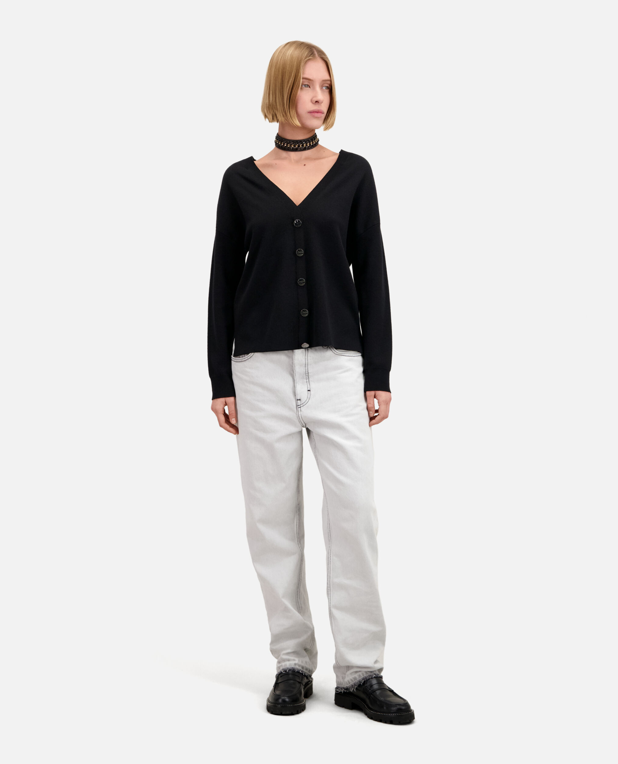 Ecru sweater with buttoning on the back