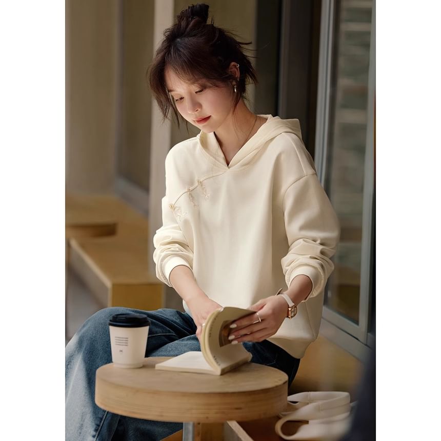 Jeonseon - V-hals hoodie met effen borduursel en verlaagde schouders