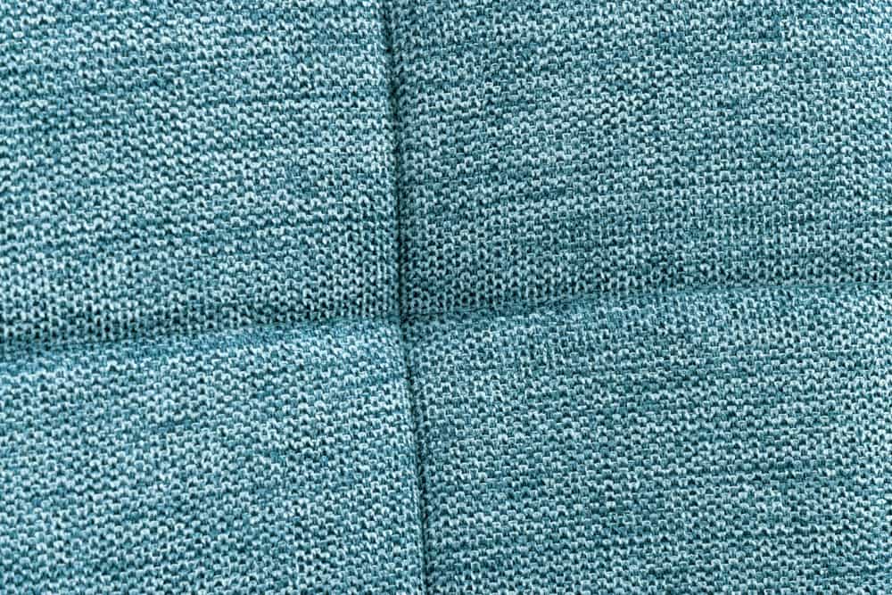 Moderner Hocker SCANDINAVIA blau Strukturstoff Metallbeine Fußhocker