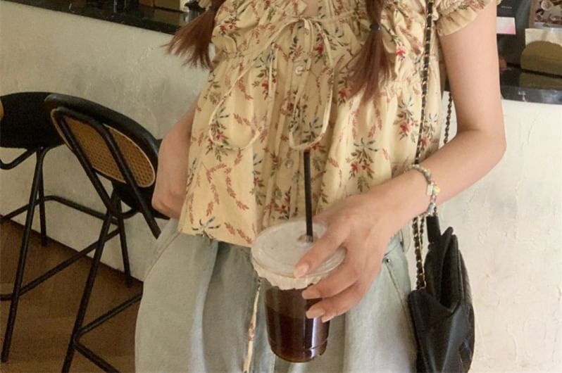 Dute - Blouse met korte mouwen, V-hals, bloemenprint, volantrand, strik aan de voorkant en knoopjes