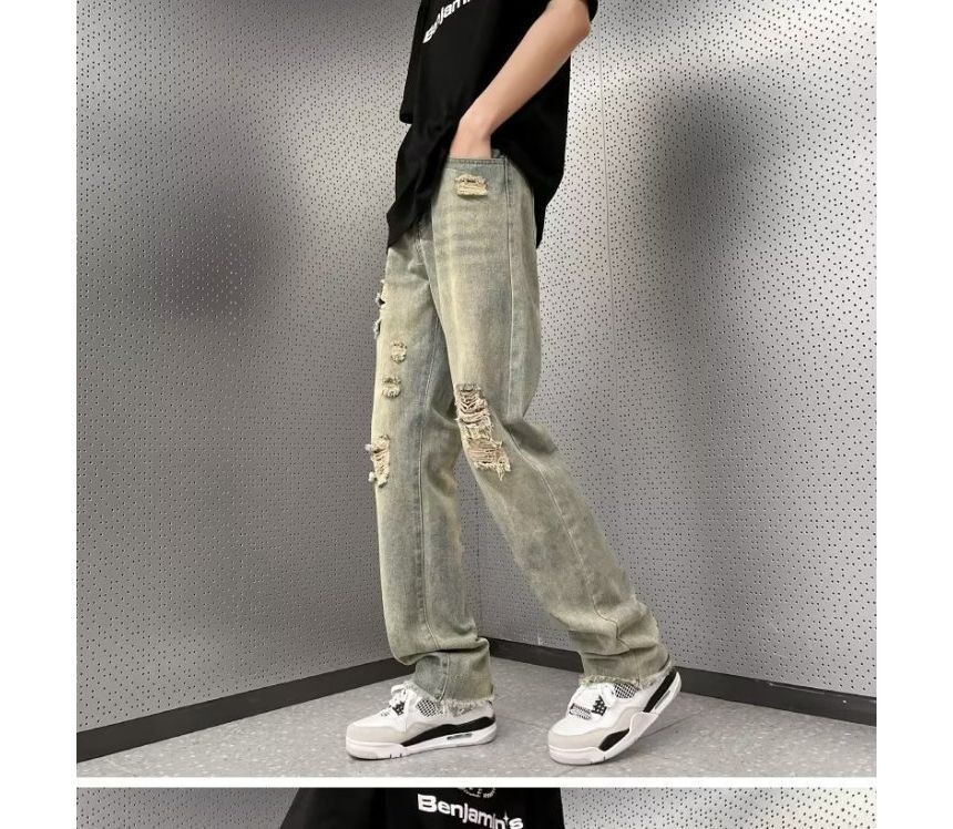 Femilina - High-waist distressed washed jeans met wijde pijpen