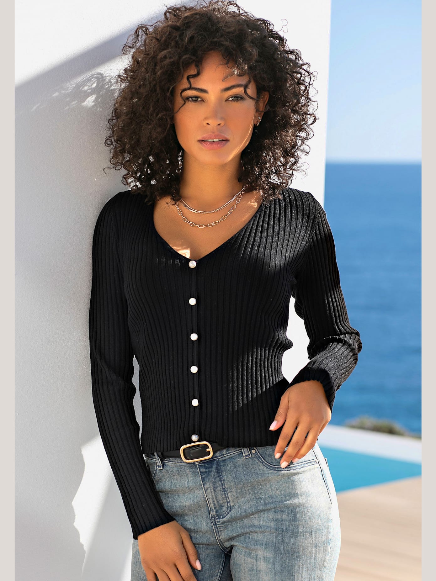 Pull à encolure en v pull affinant avec patte de boutonnage