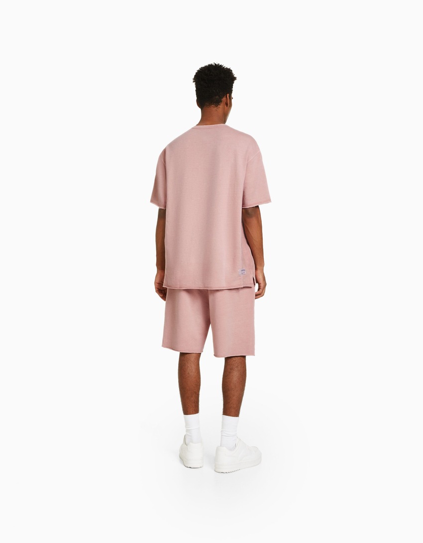 Bermudas de pelúcia com efeito desbotado