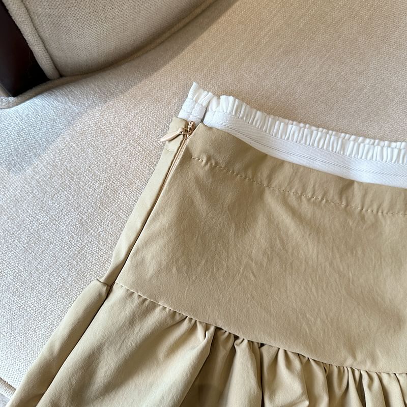 Bolgivy - Hoge taille rok met contrasterende rand en strikborduursel