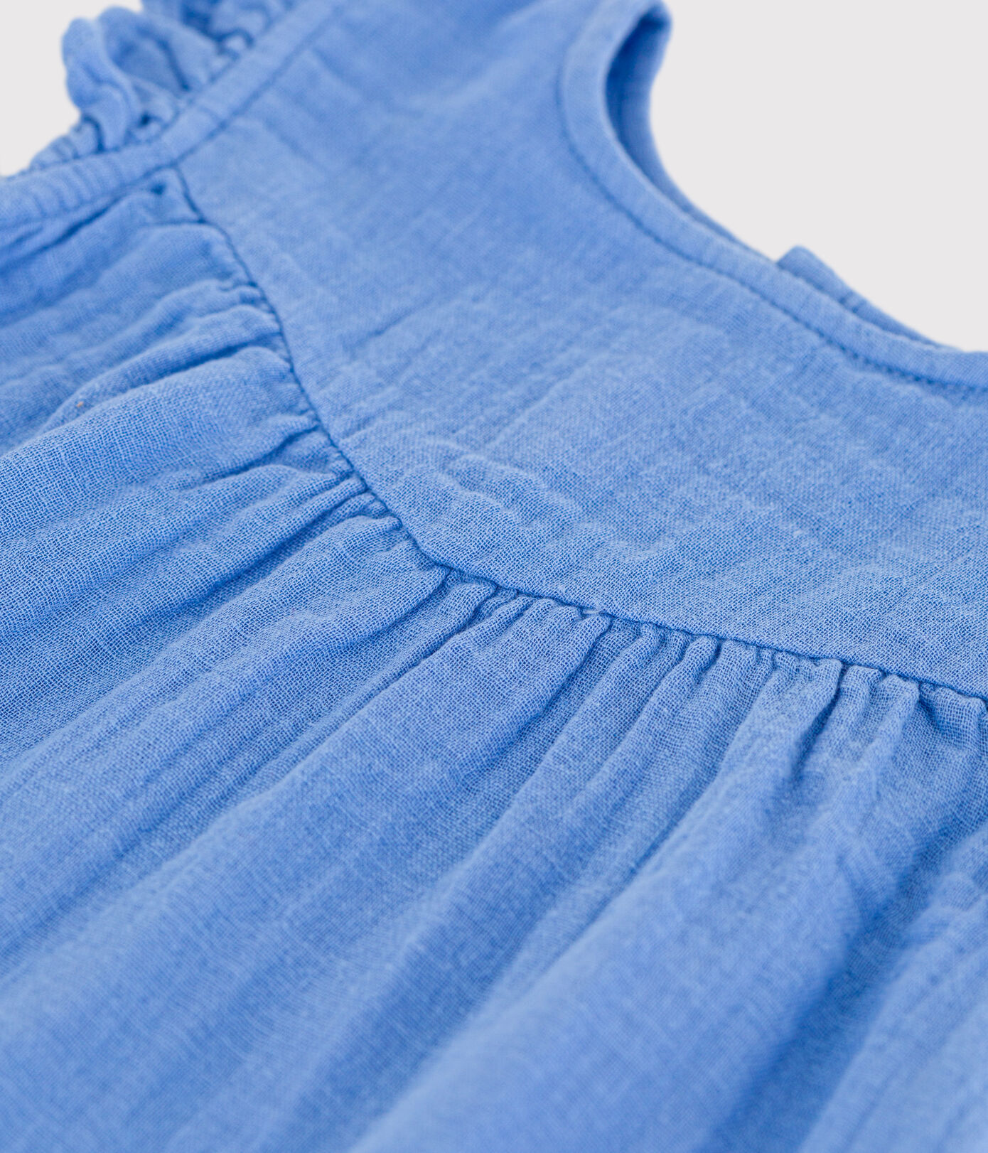 Robe sans manche bébé en gaze de coton unie