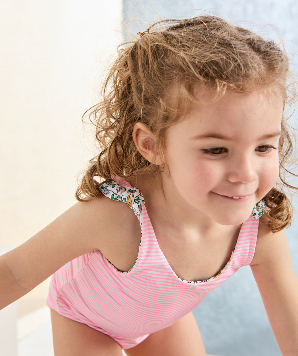 maillot de bain réversible bébé fille en fibres recyclées avec imprimés