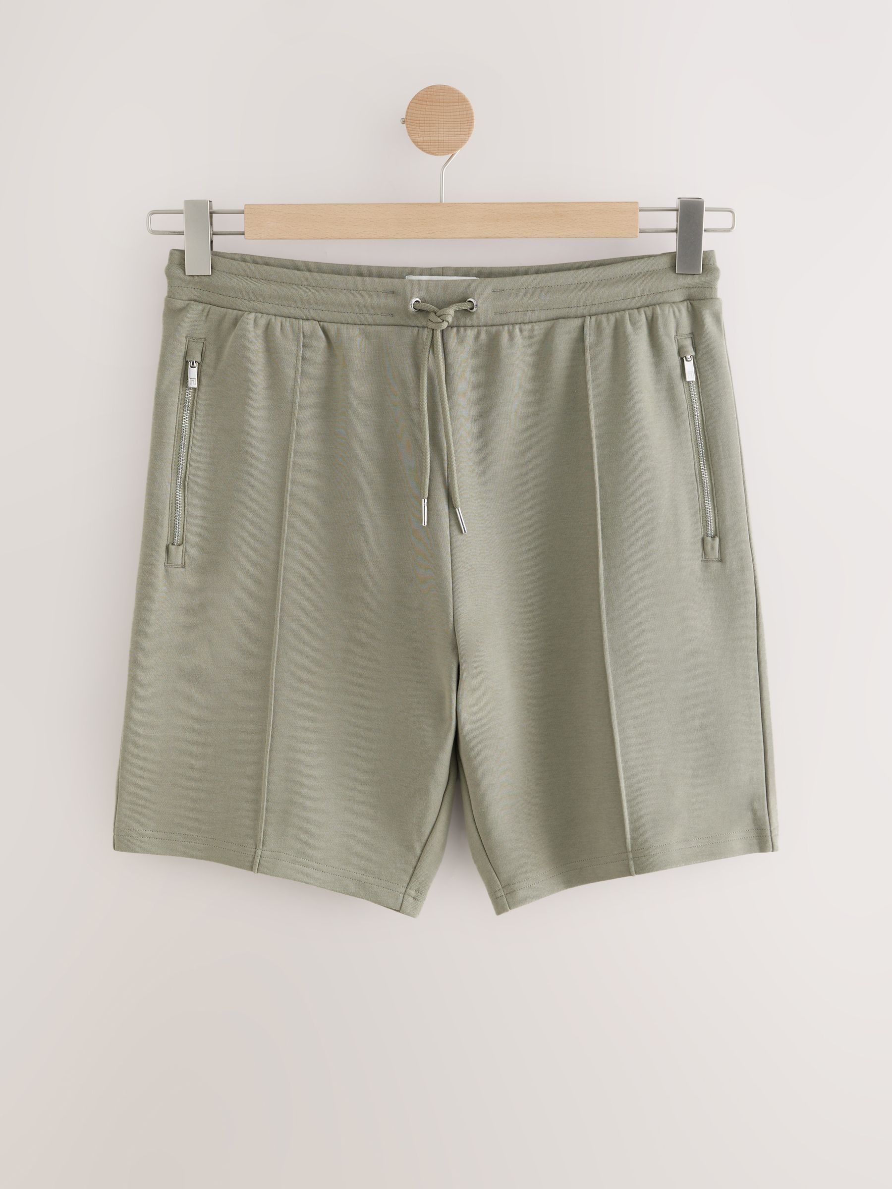 Kakigroen - Slim-fit jersey shorts met slimme ritszakken