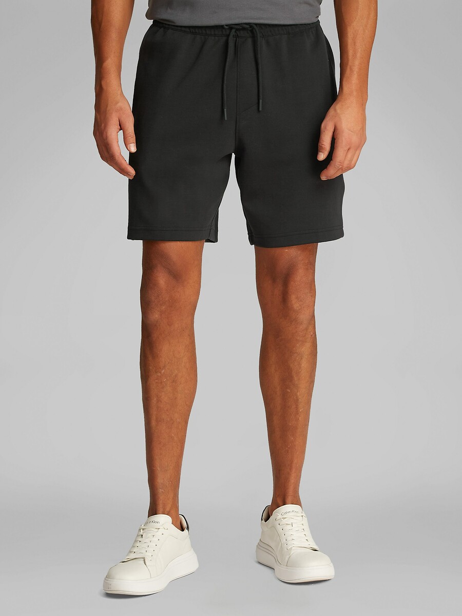 CALVIN KLEIN JEANS<br>Curto